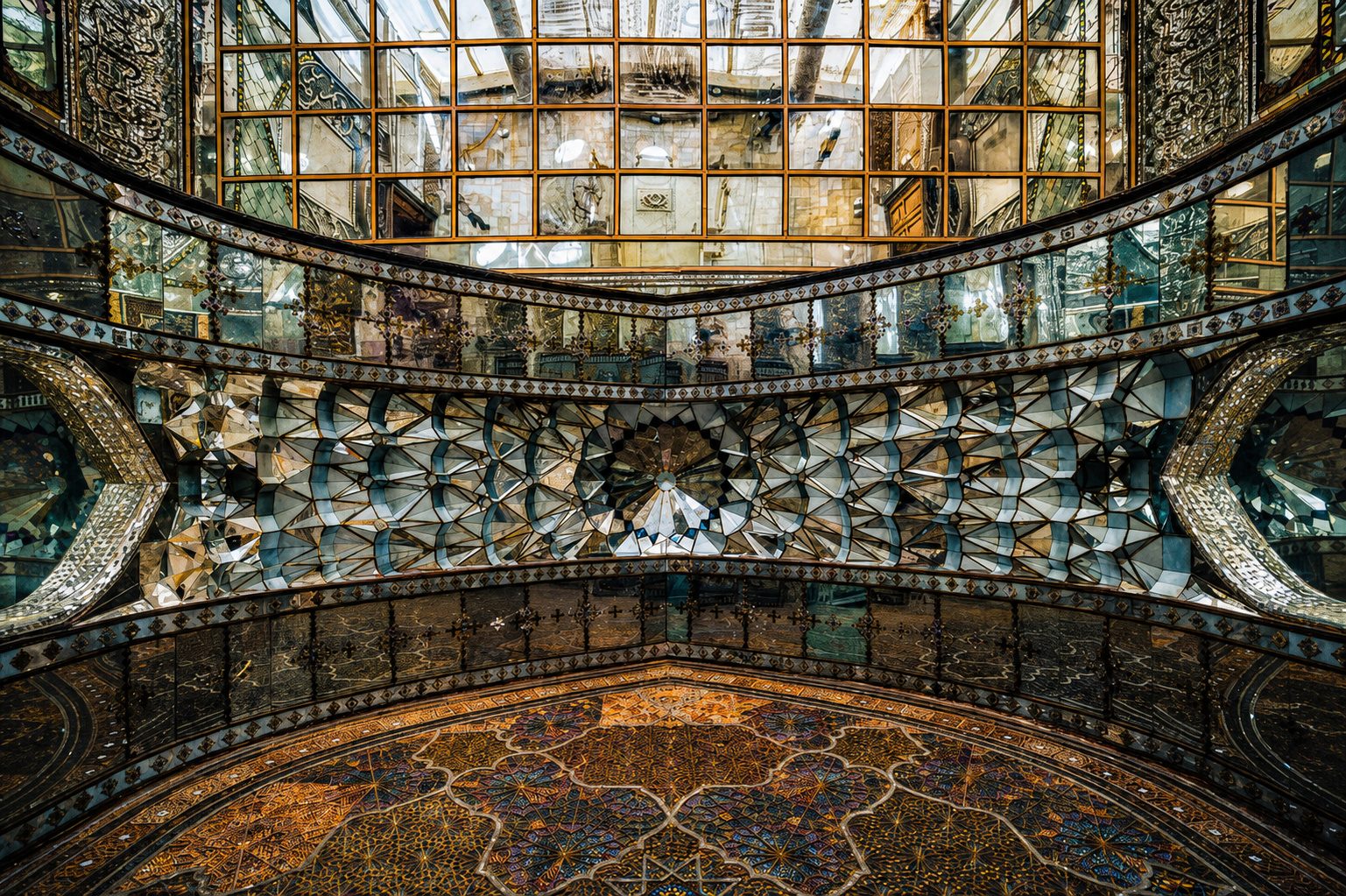 The mirrored ceiling and carpets of a hall in Golestan Palace, Tehran