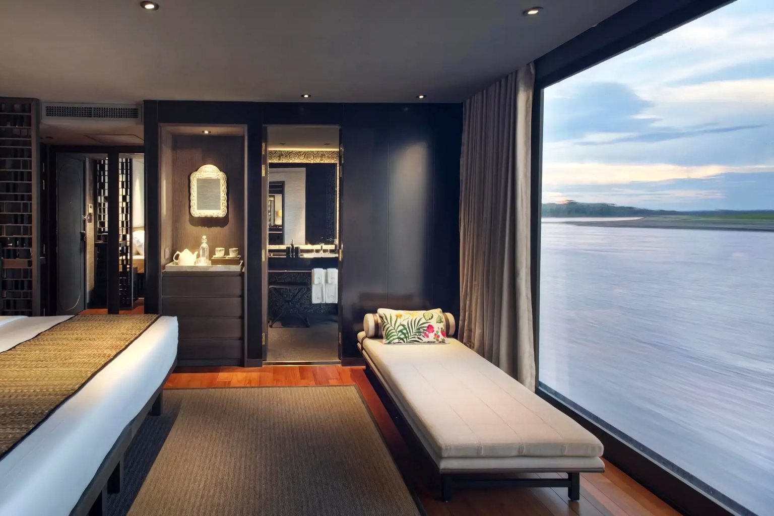 A design suite with floor-to-ceiling windows on the river