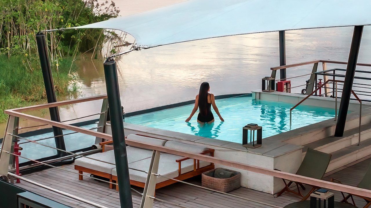 A guest in the plunge pool on the top deck