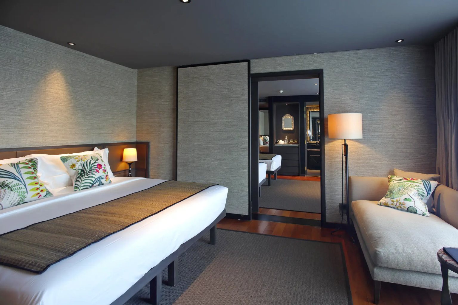 A design suite with a king bed and a sofa