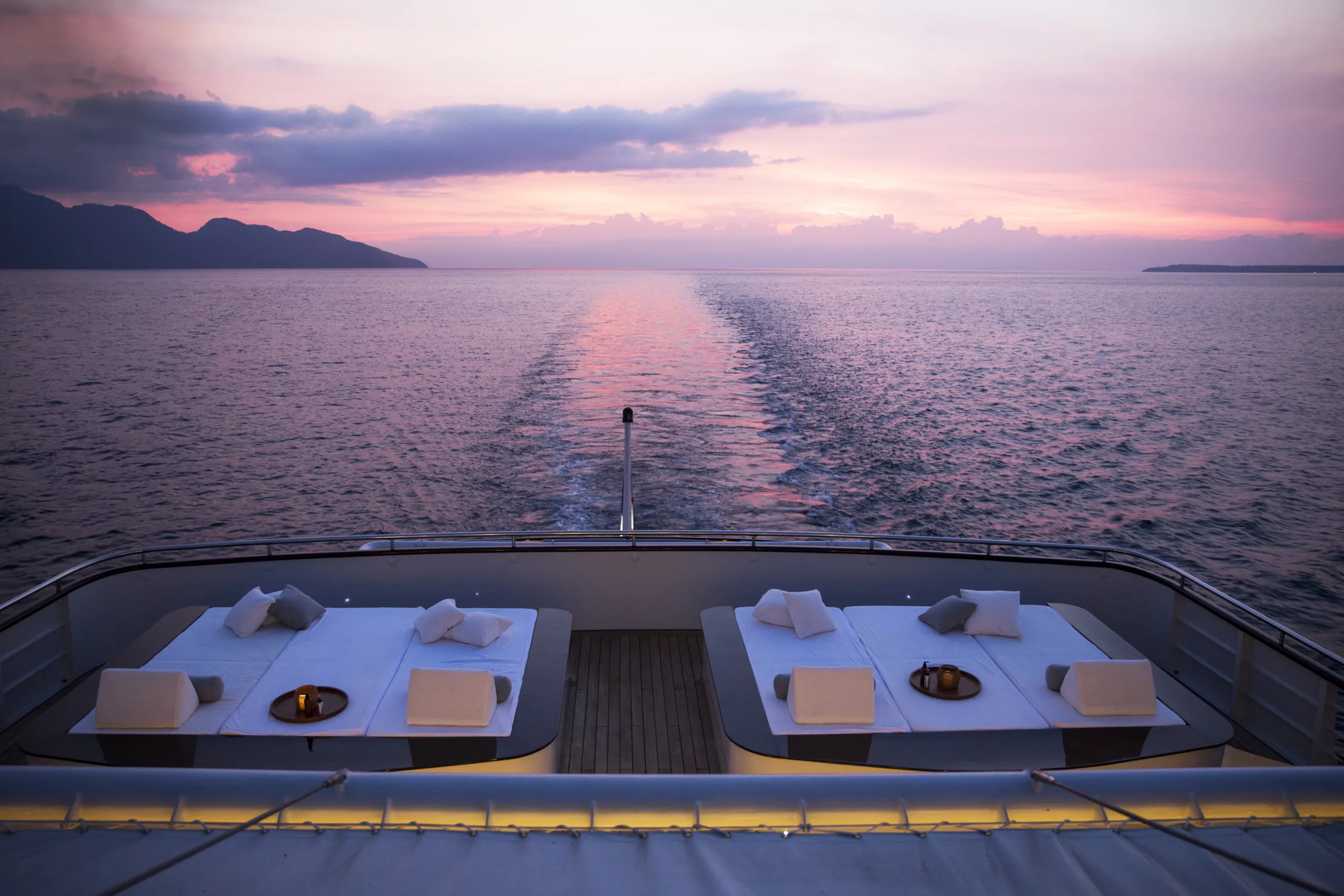Day beds at the stern of the bridge deck at sunset