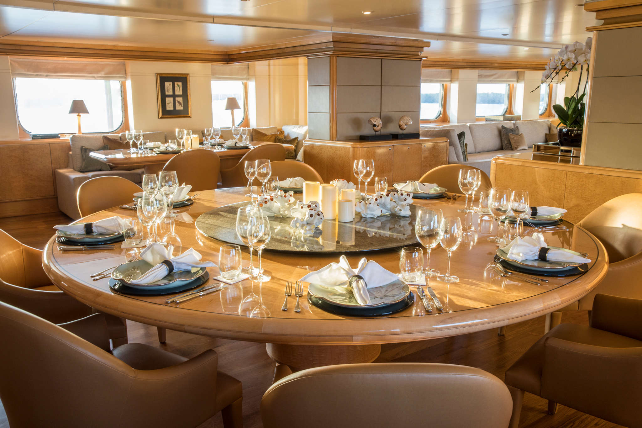The dining room, with a round table laid for dinner