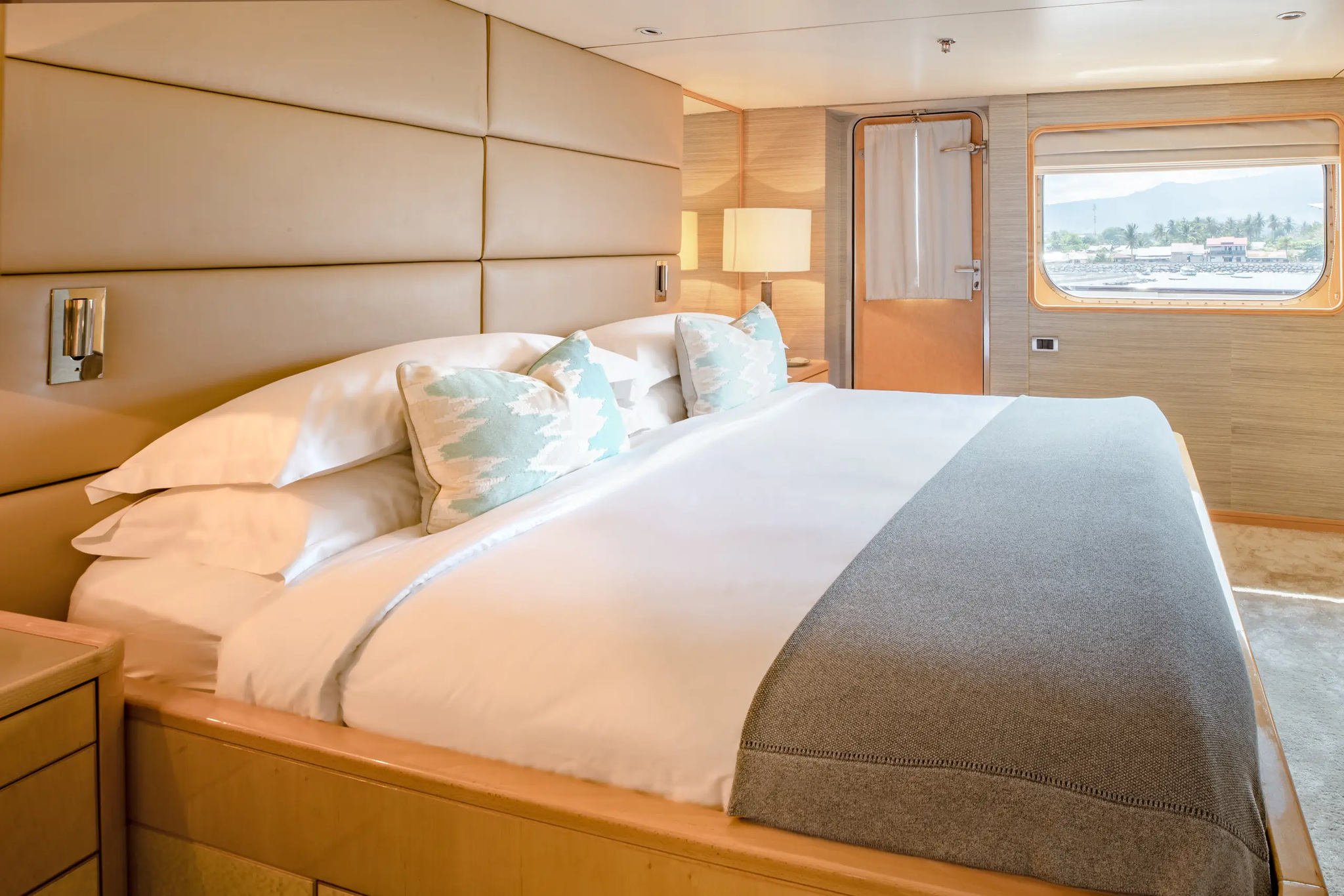 Cabin 402, Category I, with a king bed, a window and a door to the deck